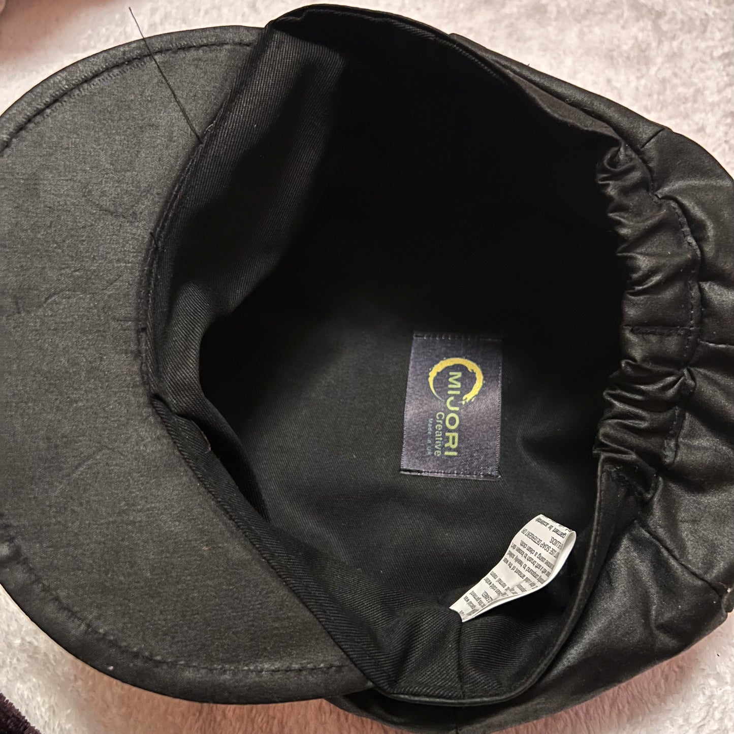 The lining of the ladies black baker boy hat